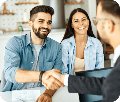 A man shaking hands with another person.